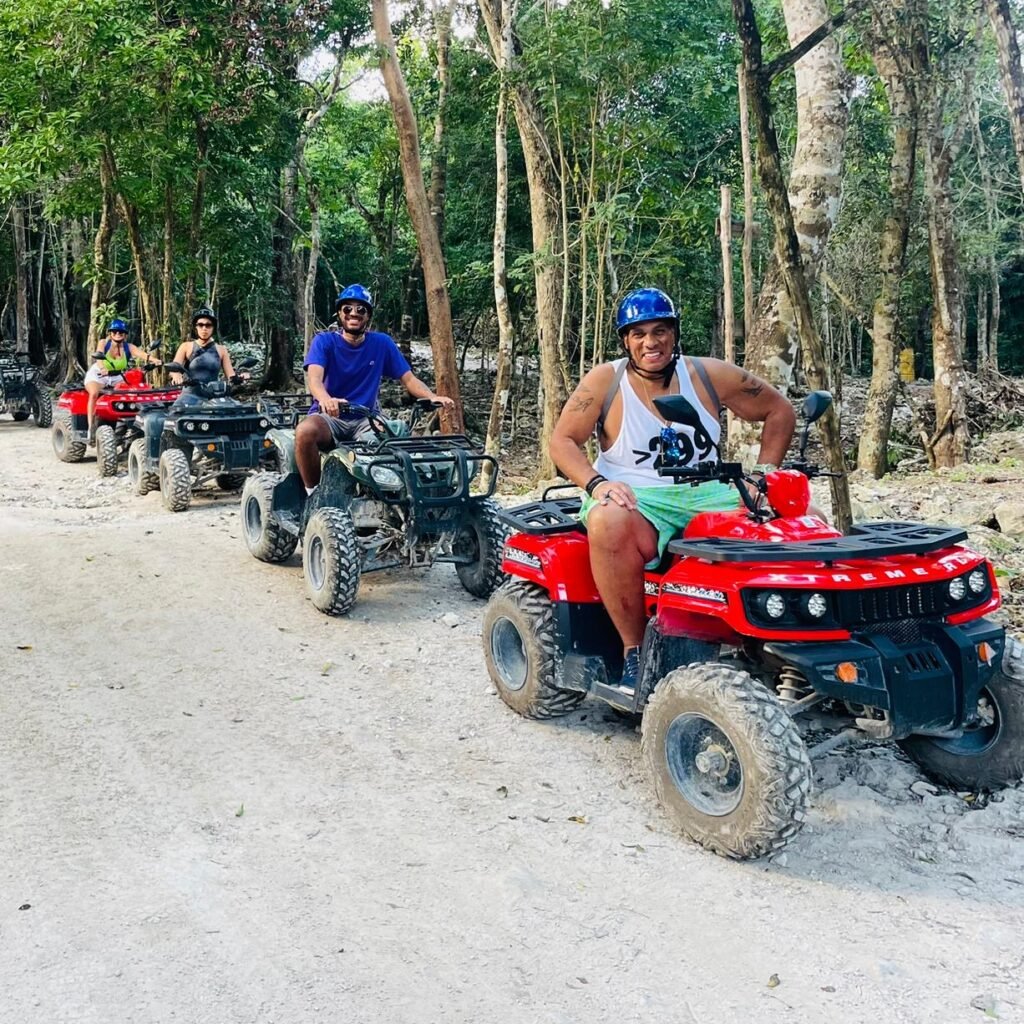 a group of people on atvs smiling