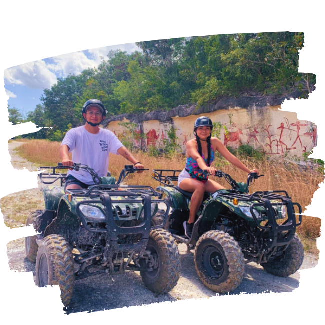 a couple on a pair of atvs