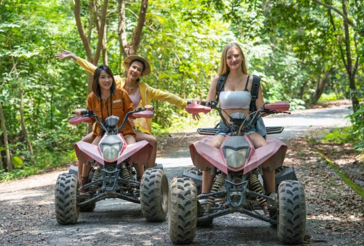 Group young woman riding off-road or ATV car travel adventure on the mountain