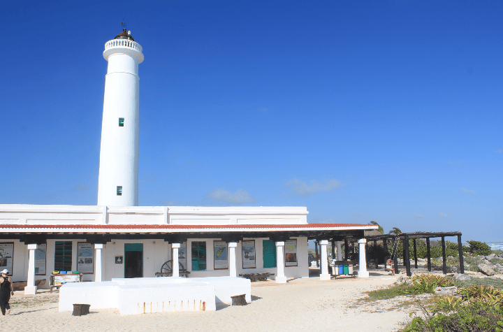 Photo of lighthouse from beach at punta sur eco park