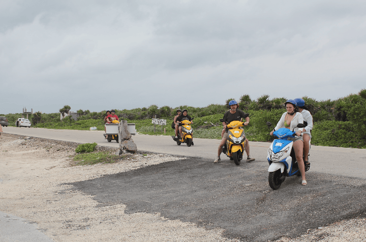 A group of travelers on scooter in cozumel
