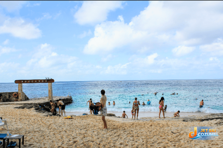 beach-clubs-in-cozumel-buccanos – Jet Ski Cozumel Beach club in Cozumel buccanos Beach area with people swimming shown from the beach