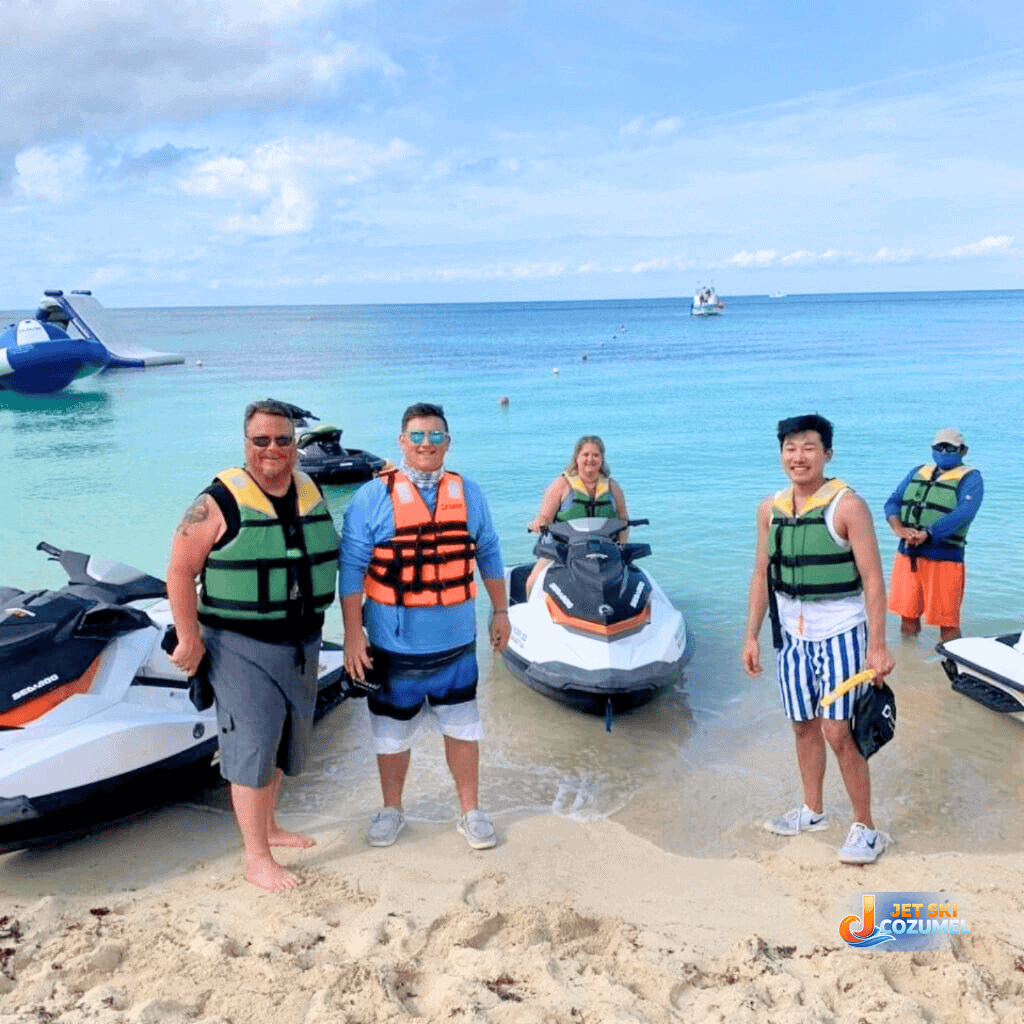 Cozumel jet ski rental customer standing near seafood jet skis