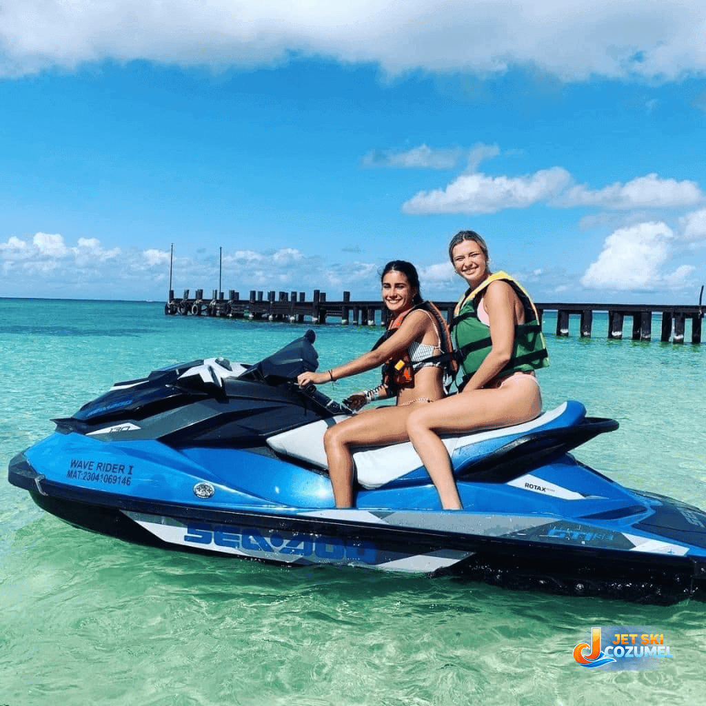 A Cozumel jet ski rental in progress two young Caucasian girls on a jet ski smiling