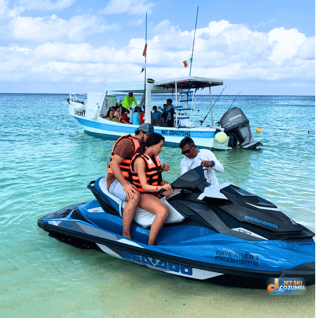 A staff member giving a jet ski rental safety demo I'm Cozumel mexico