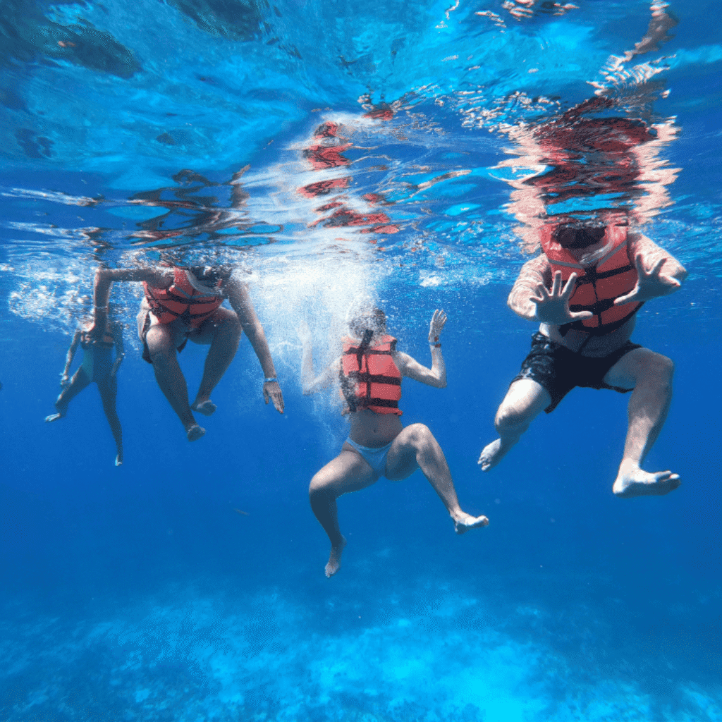 For Cozumel snorkeling tour customers shown underwater 15 ft above palancar reef